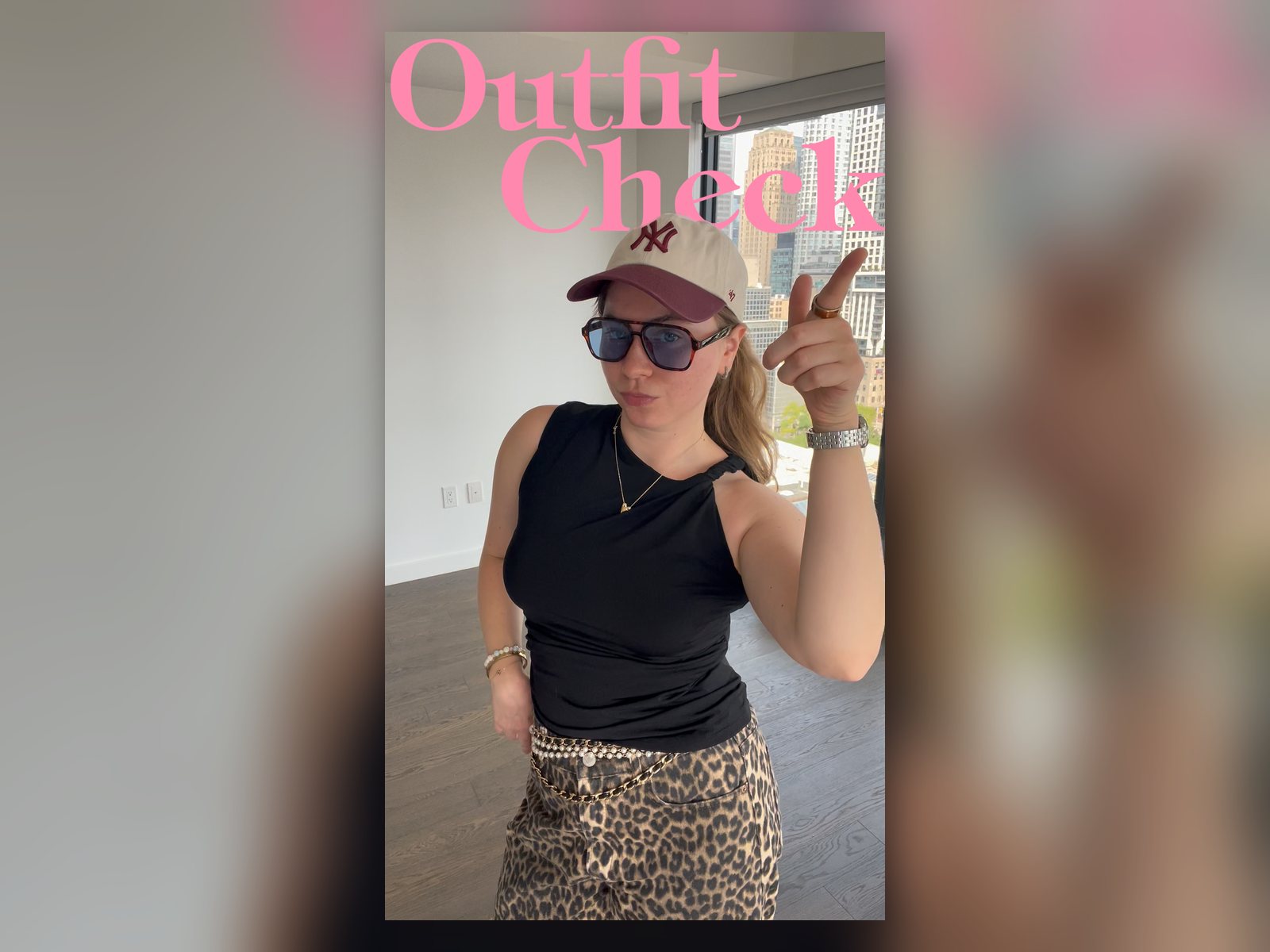Val in a cap and sunglasses with the title Outfit Check, a still from the GRWM reel