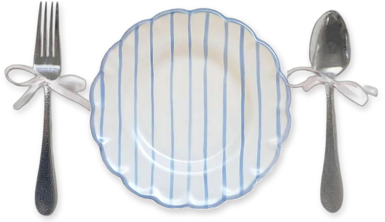 An empty scalloped plate with blue stripes, a fork on the left and a spoon on the right, each tied with a white ribbon bow